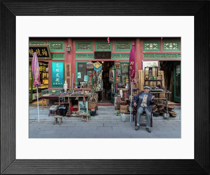 Framed Print : Shopkeeper outside antique shop, Beijing, China Framed Print : Shopkeeper outside antique shop, Beijing, China