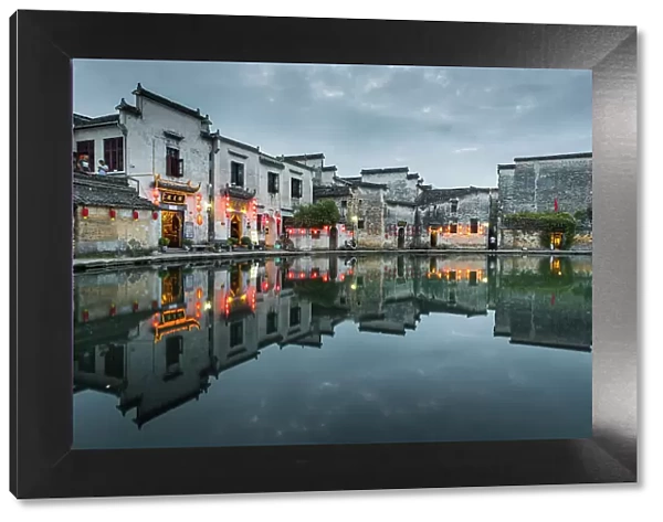 Village buildings reflected in pond, Hongcun, China