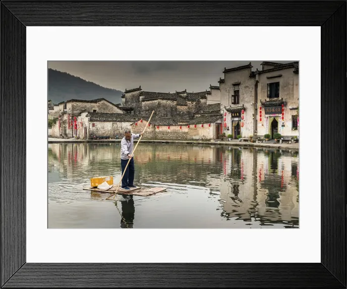 Framed Print : Man collecting rubbish in pond, Hongcun, China Framed Print : Man collecting rubbish in pond, Hongcun, China
