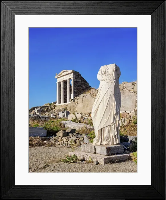 Framed Print : Headless Statue and the Temple of Isis, Delos Archaeological Site, Delos Island, Cyclades, Greece Framed Print : Headless Statue and the Temple of Isis, Delos Archaeological Site, Delos Island, Cyclades, Greece