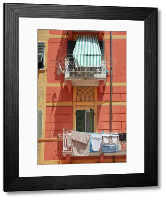 Framed Print : Clothes line on a balcony of a building in the historical cask of Lerici, La Spezia, Liguria, Italy Framed Print : Clothes line on a balcony of a building in the historical cask of Lerici, La Spezia, Liguria, Italy