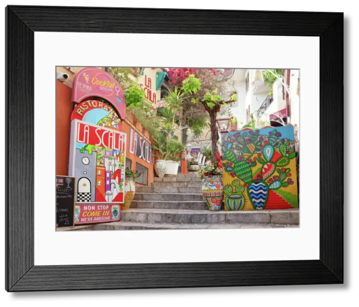 Framed Print : Old town street filled with billboards and artwork, Taormina, Sicily, Italy Framed Print : Old town street filled with billboards and artwork, Taormina, Sicily, Italy