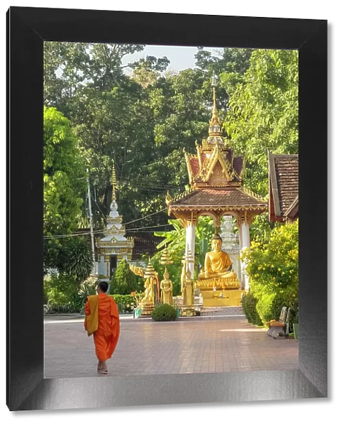 Monk walking in Wat Sisaket, Vientiane (capital city), Laos