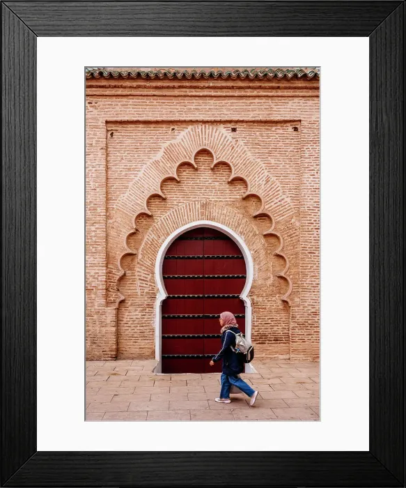Framed Print : Woman student and typical arab door, Marrakech, Morocco Framed Print : Woman student and typical arab door, Marrakech, Morocco