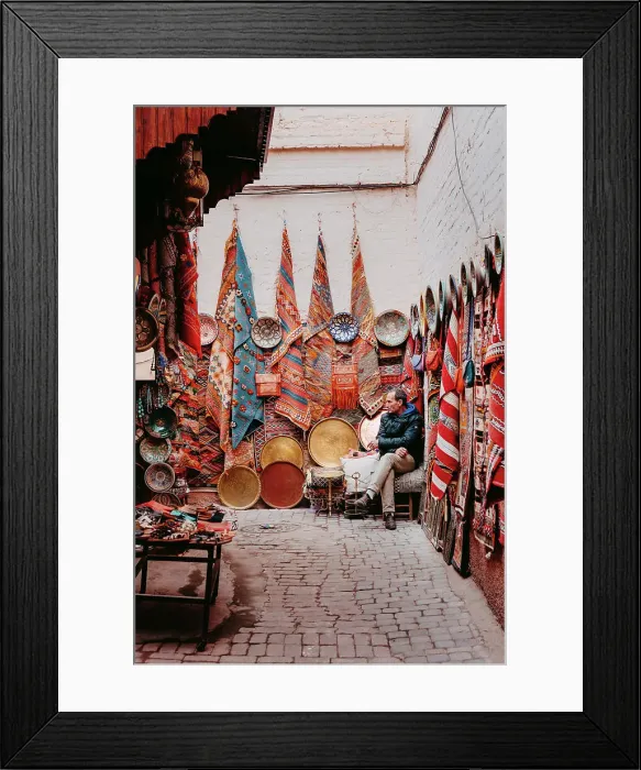 Framed Print : Seller of carpets and fabrics in the souk, Marrakech Framed Print : Seller of carpets and fabrics in the souk, Marrakech