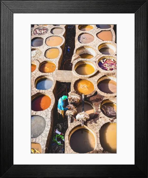 Framed Print : High angle view of man working at the vats of colours in the tannery of Fes, Morocco Framed Print : High angle view of man working at the vats of colours in the tannery of Fes, Morocco