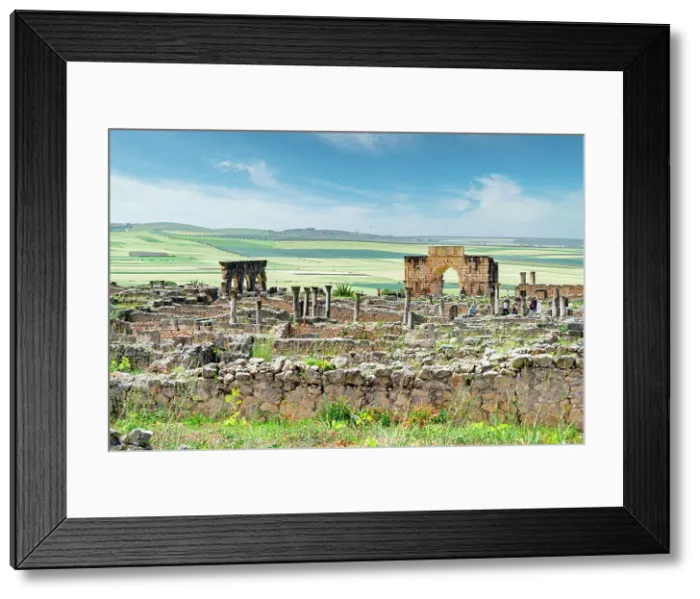 Framed Print : Triumphal Arch of Caracalla at Volubilis and old roman ruins, Volubilis, Meknes, Morocco Framed Print : Triumphal Arch of Caracalla at Volubilis and old roman ruins, Volubilis, Meknes, Morocco