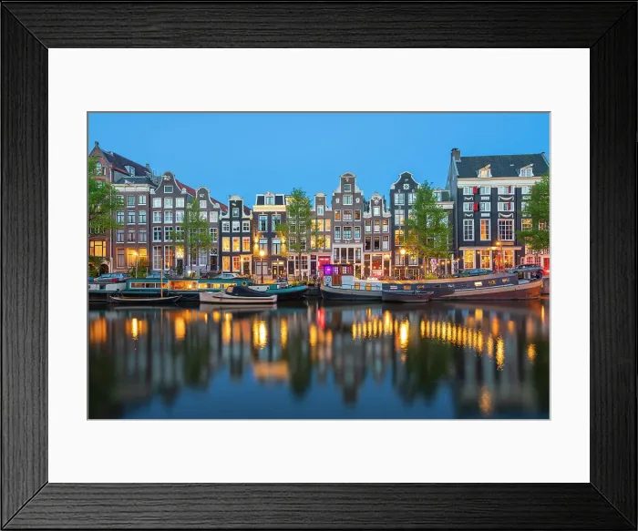Framed Print : Boats moored in Singel canal near typical houses at twilight, Amsterdam, Netherlands Framed Print : Boats moored in Singel canal near typical houses at twilight, Amsterdam, Netherlands