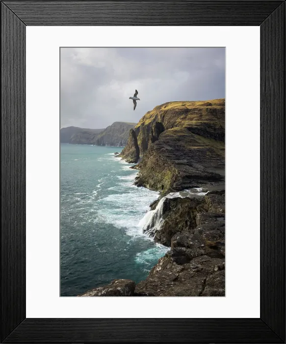Framed Print : Bosdalafossur is a 30m high waterfall falling into the Atlantic Ocean. It's located at the end of Leitisvatn Lake. Island of Vagar. Faroe Islands Framed Print : Bosdalafossur is a 30m high waterfall falling into the Atlantic Ocean. It's located at the end of Leitisvatn Lake. Island of Vagar. Faroe Islands