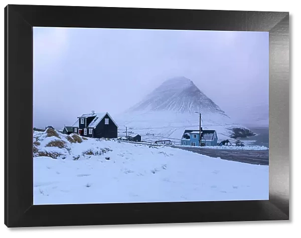 The remote village of Viðareiði covered by snow. Island of Viðoy. Faroe Islands