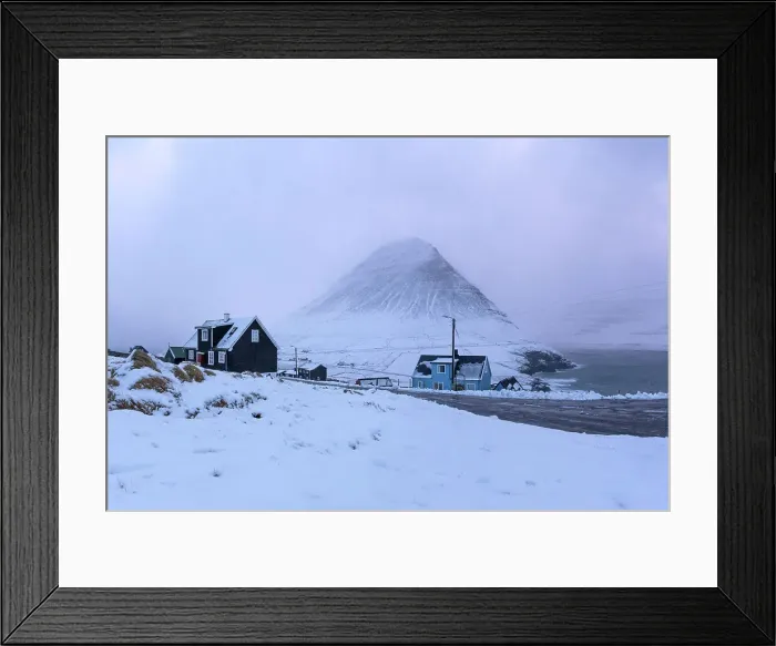 Framed Print : The remote village of Viðareiði covered by snow. Island of Viðoy. Faroe Islands