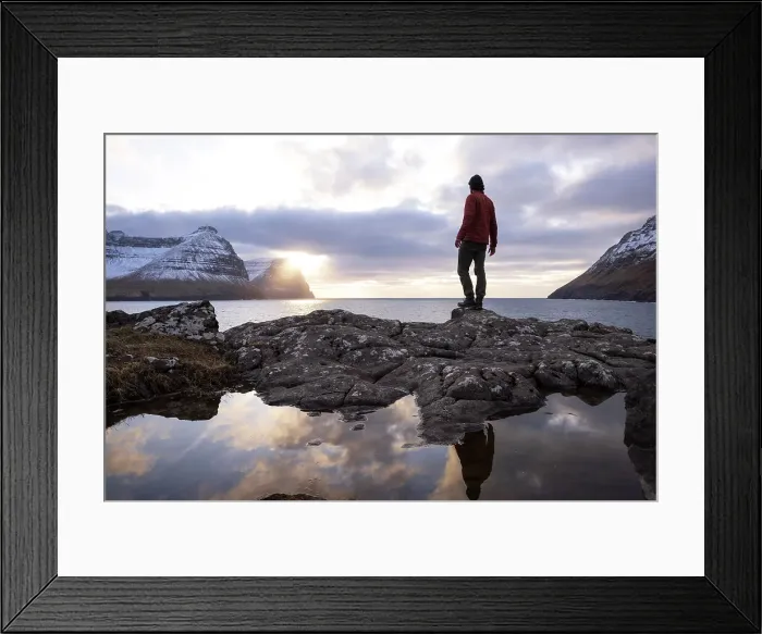 Framed Print : A guy standing on the coast in Viðareiði at sunset. Island of Viðoy. Faroe Islands Framed Print : A guy standing on the coast in Viðareiði at sunset. Island of Viðoy. Faroe Islands