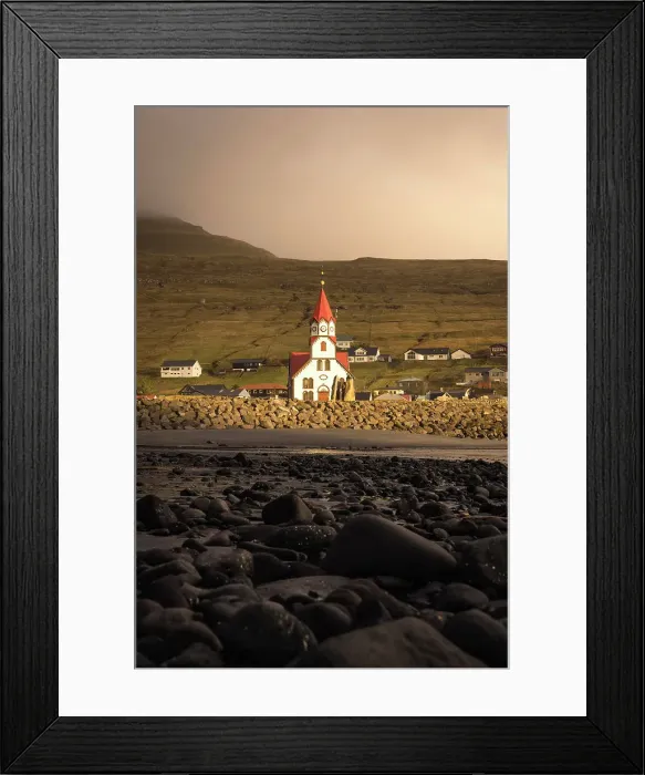 Framed Print : The church in the village of Sandavagur at sunset. Island of Vagar. Faroe Islands