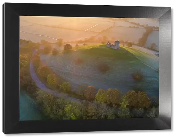 Aerial view of Burrow Mump and the ruins of St Michael's Church on a frosty autumn morning, Burrowbridge, Somerset, England. Autumn (November) 2021