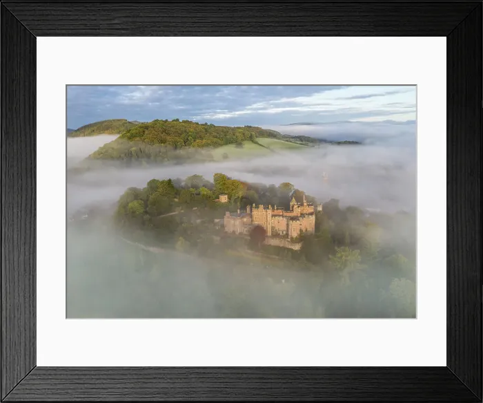 Framed Print : Aerial view of Dunster Castle on a misty autumn morning, Exmoor National Park, Somerset, England. Autumn (October) 2022 Framed Print : Aerial view of Dunster Castle on a misty autumn morning, Exmoor National Park, Somerset, England. Autumn (October) 2022