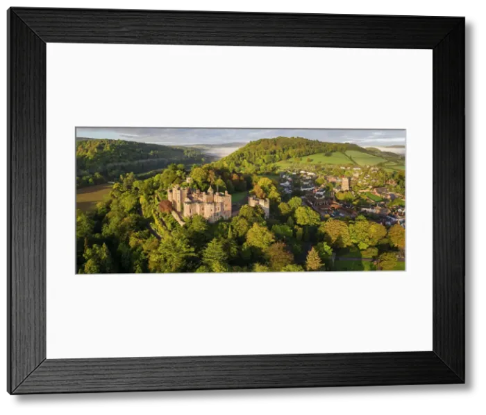 Framed Print : Aerial view of Dunster Castle and village, Exmoor National Park, Somerset, England. Autumn (October) 2022 Framed Print : Aerial view of Dunster Castle and village, Exmoor National Park, Somerset, England. Autumn (October) 2022