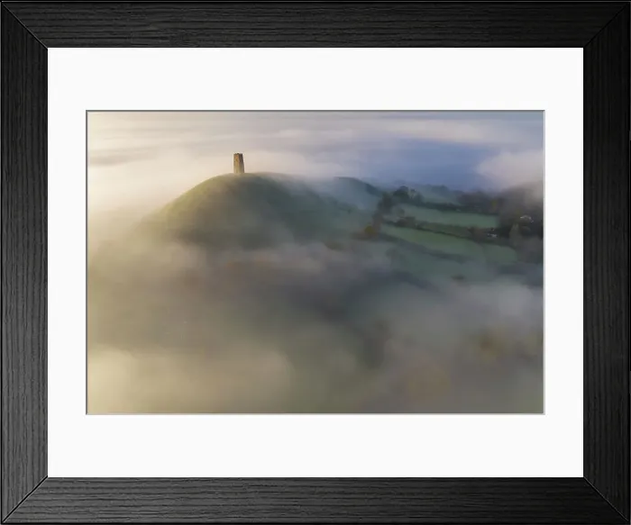 Framed Print : Aerial view of Glastonbury Tor on a beautiful misty autumn morning, Glastonbury, Somerset, England. Autumn (November) 2022 Framed Print : Aerial view of Glastonbury Tor on a beautiful misty autumn morning, Glastonbury, Somerset, England. Autumn (November) 2022