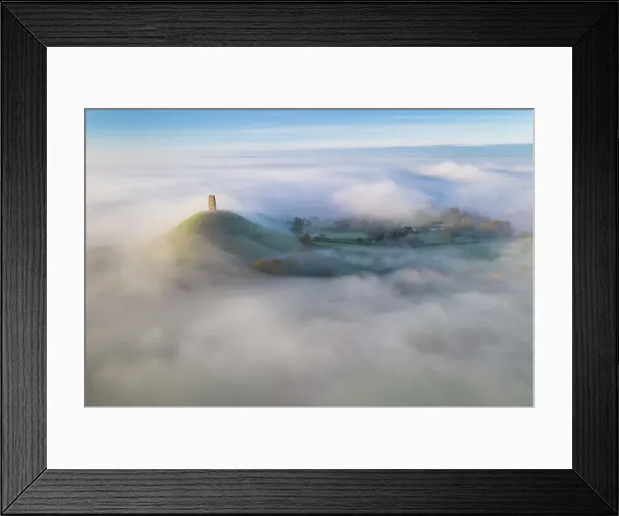 Framed Print : Aerial view of St Michael's Tower on Glastonbury Tor at dawn on a misty morning, Glastonbury, Somerset, England. Autumn (November) 2022 Framed Print : Aerial view of St Michael's Tower on Glastonbury Tor at dawn on a misty morning, Glastonbury, Somerset, England. Autumn (November) 2022