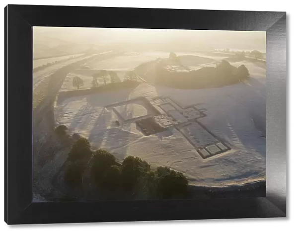 Aerial view of Old Sarum on a frosty morning, showing the foundations of the cathedral, Wiltshire, England. Winter (February) 2023