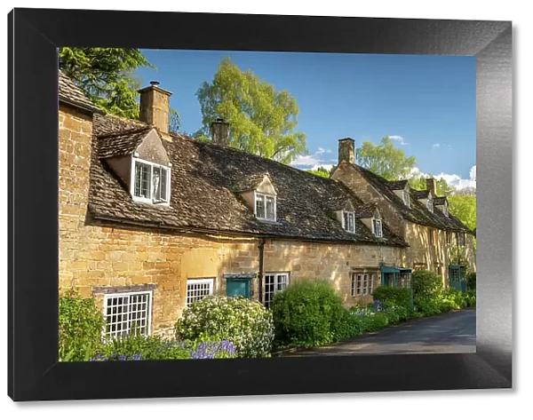 Pretty cottages in the idyllic Cotswold village of Snowshill, Gloucestershire, England. Spring (May) 2021