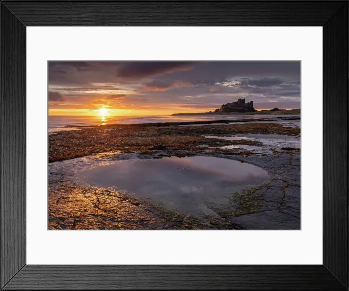 Framed Print : Spectacular sunrise over the North Sea near Bamburgh Castle, Northumberland, England. Autumn (October) 2021 Framed Print : Spectacular sunrise over the North Sea near Bamburgh Castle, Northumberland, England. Autumn (October) 2021