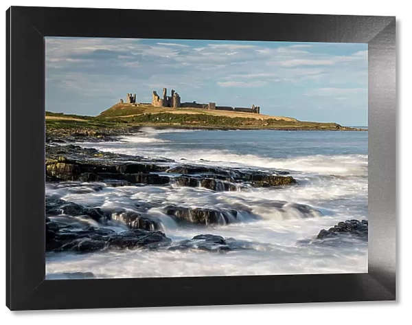 The magnificent ruins of Dunstanburgh Castle on the dramatic Northumbrian coast, Craster, Northumberland, England. Autumn (October) 2021