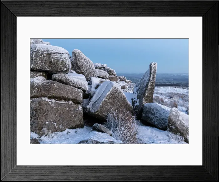 Framed Print : Snow covered granite outcrop at Belstone Tor in Dartmoor National Park, Devon, England. Winter (December) 2022