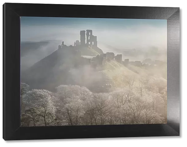 The impressive ruins of Corfe Castle on a chill winter morning in the Purbecks, Dorset, England. Winter (February) 2023