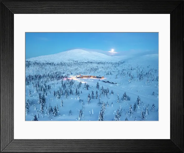 Framed Print : Ski area nearby a frozen snowy forest lit by moon at blue hour, aerial view, Yllastunturi National Park, Pallas, Lapland, Finland Framed Print : Ski area nearby a frozen snowy forest lit by moon at blue hour, aerial view, Yllastunturi National Park, Pallas, Lapland, Finland