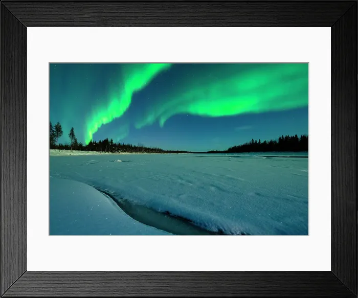 Framed Print : Northern Lights glowing bright over the snowy forest and frozen river in winter, Levi, Kittila, Lapland, Finland Framed Print : Northern Lights glowing bright over the snowy forest and frozen river in winter, Levi, Kittila, Lapland, Finland