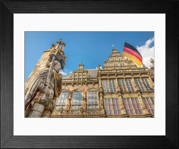 Framed Print : Statue of Bremen Roland in front of the town hall with the German flag on the market square, Bremen, Germany Framed Print : Statue of Bremen Roland in front of the town hall with the German flag on the market square, Bremen, Germany