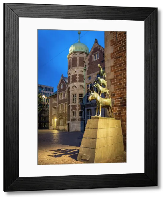 Framed Print : Bronze statue of Bremer Stadtmusikanten at the town hall in the evening, Bremen, Germany Framed Print : Bronze statue of Bremer Stadtmusikanten at the town hall in the evening, Bremen, Germany
