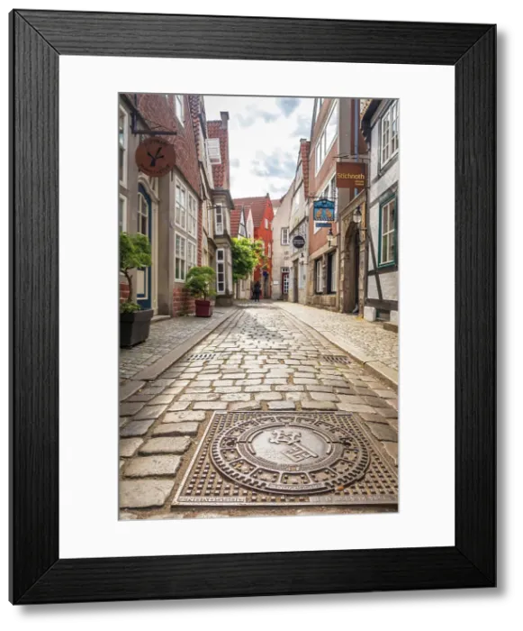 Framed Print : Bronze gully cover with Bremen city coat of arms in the historic Schnoor district, Bremen, Germany Framed Print : Bronze gully cover with Bremen city coat of arms in the historic Schnoor district, Bremen, Germany