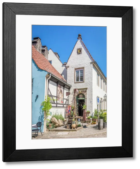 Framed Print : Narrow houses at the entrance to the historic Schnoor district, Bremen, Germany Framed Print : Narrow houses at the entrance to the historic Schnoor district, Bremen, Germany