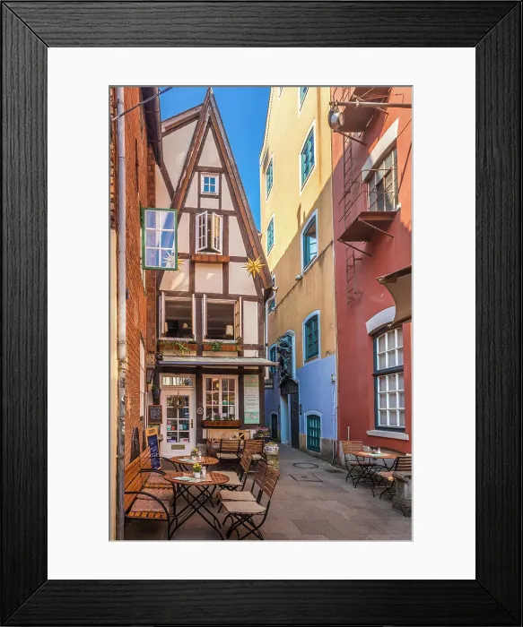 Framed Print : Alley with colorful houses in the historic Schnoor district, Bremen, Germany Framed Print : Alley with colorful houses in the historic Schnoor district, Bremen, Germany
