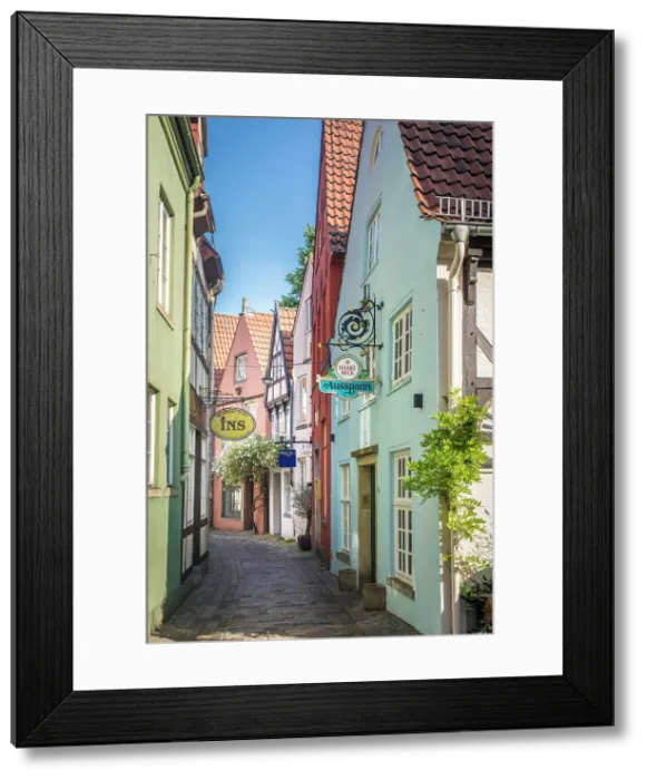 Framed Print : Alley with colorful houses in the historic Schnoor district, Bremen, Germany Framed Print : Alley with colorful houses in the historic Schnoor district, Bremen, Germany