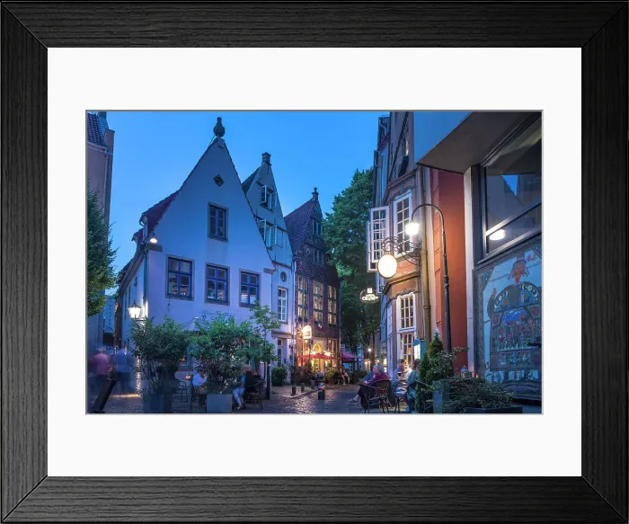 Framed Print : Street cafes in the historic Schnoor district in the evening, Bremen, Germany Framed Print : Street cafes in the historic Schnoor district in the evening, Bremen, Germany