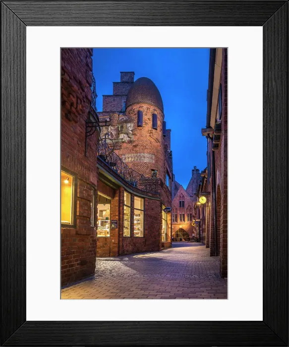 Framed Print : Craftsman`s yard in the illuminated Boettcherstrasse in the evening, Bremen, Germany Framed Print : Craftsman`s yard in the illuminated Boettcherstrasse in the evening, Bremen, Germany