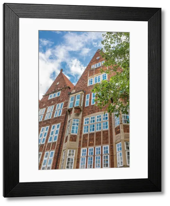 Framed Print : Traditional brick houses at the southern entrance to Boettcherstrasse, Bremen, Germany Framed Print : Traditional brick houses at the southern entrance to Boettcherstrasse, Bremen, Germany