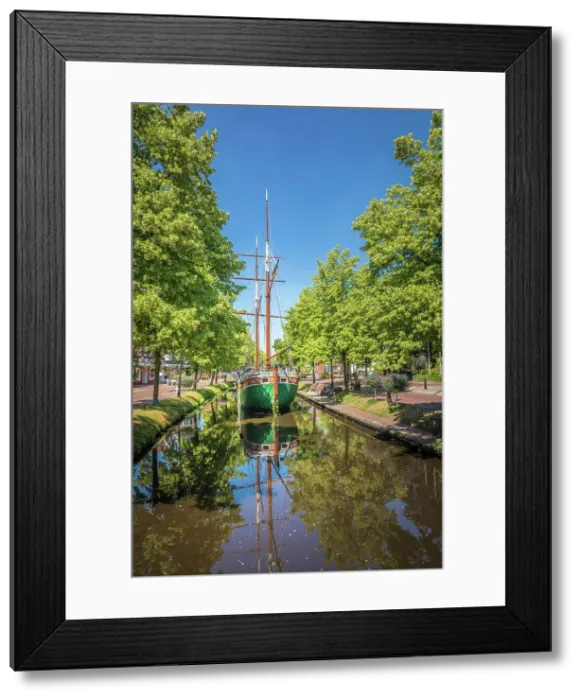 Framed Print : Historical cargo glider Margaretha on the main canal in the old town of Papenburg, Emsland, Lower Saxony, Germany Framed Print : Historical cargo glider Margaretha on the main canal in the old town of Papenburg, Emsland, Lower Saxony, Germany