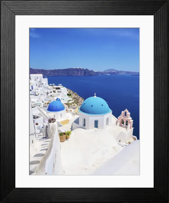 Framed Print : Iconic blue domed churches of Resurrection of the Lord and Saint Spyridon, elevated view, Oia Village, Santorini or Thira Island, Cyclades, Greece Framed Print : Iconic blue domed churches of Resurrection of the Lord and Saint Spyridon, elevated view, Oia Village, Santorini or Thira Island, Cyclades, Greece