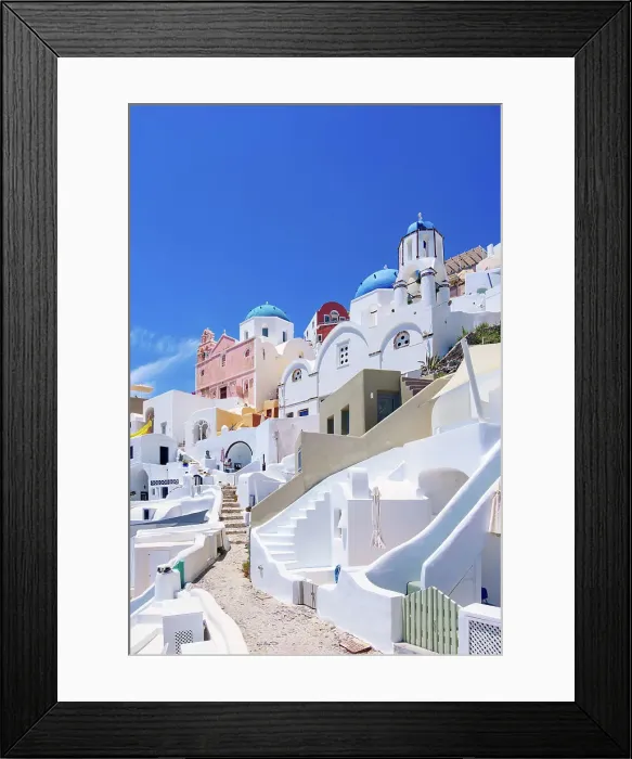 Framed Print : Iconic blue domed churches of Saint Spyridon and Resurrection of the Lord, low angle view, Oia Village, Santorini or Thira Island, Cyclades, Greece Framed Print : Iconic blue domed churches of Saint Spyridon and Resurrection of the Lord, low angle view, Oia Village, Santorini or Thira Island, Cyclades, Greece
