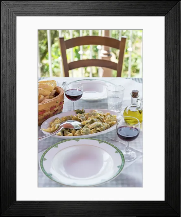 Framed Print : europe, Italy, Liguria, a lunch table in an agriturismo with home made ravioli and red wine