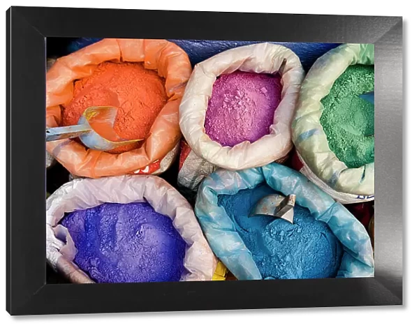 Overhead view of colored powders for textile dyes in the street markets, Morocco