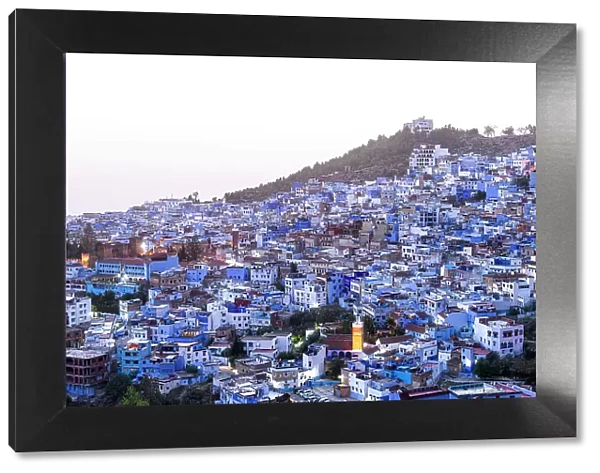 High angle view of the fairy tale blue city of Chefchaouen at dusk, Morocco