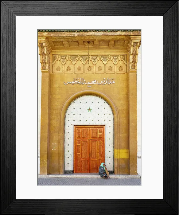 Framed Print : Senior woman with hijab sitting outside a doorway at majestic gold colored entrance of medina, Rabat, Morocco Framed Print : Senior woman with hijab sitting outside a doorway at majestic gold colored entrance of medina, Rabat, Morocco