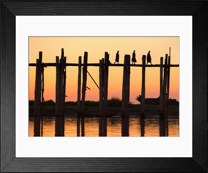 Framed Print : Silhouette of three Buddhists monks walking on the U-Bein wooden teak bridge at sunset, Taungthaman Lake, Amarapura, Mandalay, Myanmar Framed Print : Silhouette of three Buddhists monks walking on the U-Bein wooden teak bridge at sunset, Taungthaman Lake, Amarapura, Mandalay, Myanmar