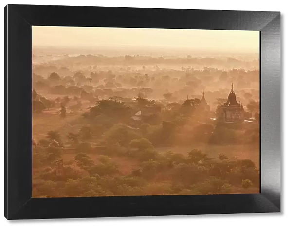 Sun rays at sunrise over the Bagan Valley archaeological area temples, Old Bagan, Mandalay Region, Myanmar. Bagan was declared a UNESCO World Heritage Site in 2019