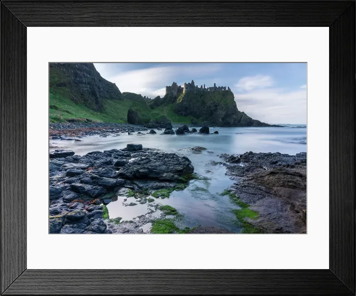 Framed Print : Dunluce Castle perched dramatically on the clifftops of the Causeway Coast, County Antrim, Northern Ireland. Autumn (November) 2022 Framed Print : Dunluce Castle perched dramatically on the clifftops of the Causeway Coast, County Antrim, Northern Ireland. Autumn (November) 2022