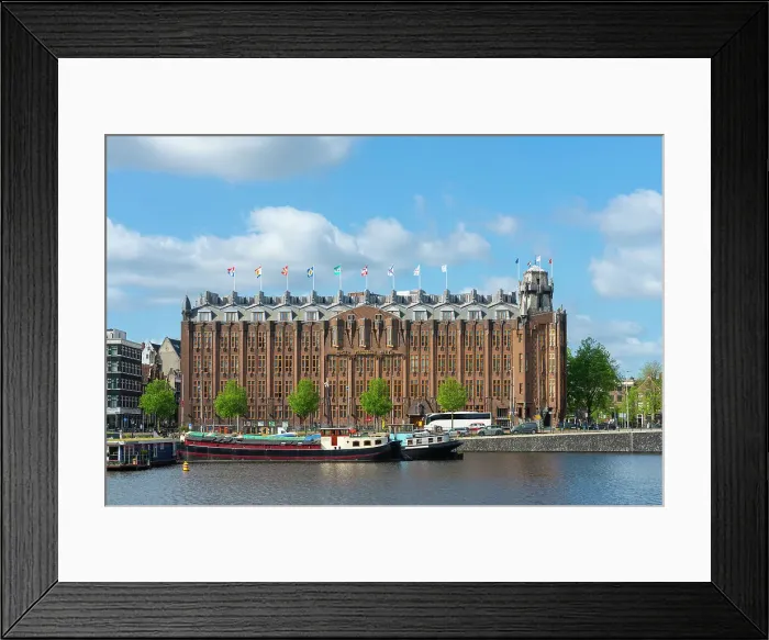 Framed Print : Boats moored in front of Grand Hotel Amrath, Amsterdam, Netherlands Framed Print : Boats moored in front of Grand Hotel Amrath, Amsterdam, Netherlands